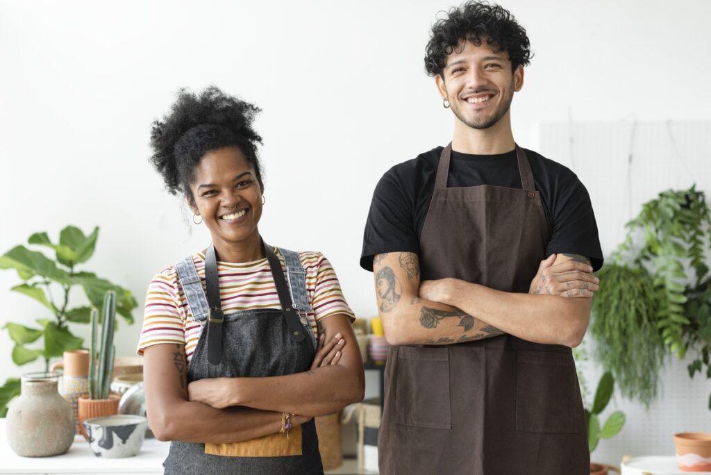 Happy multiracial couple small business owners